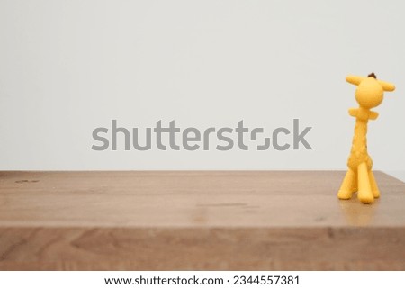 wooden table with white wall background for kids product photography 