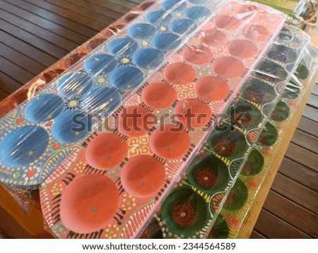 Traditional Indonesia's Game called Congklak or Mancala made of wood and clay for old-time board game children.