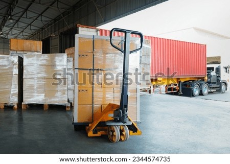 Package Boxes Wrapped Plastic Stacked on Pallets Load into Cargo Container. Trucks Loading Dock Warehouse. Supply Chain Warehouse Shipping, Shipment Goods. Freight Truck Logistic, Cargo Transport. Royalty-Free Stock Photo #2344574735