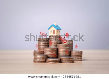 The coin shows a percentage symbol icon. Rising home interest rate concept business investment, finance, marketing and sales