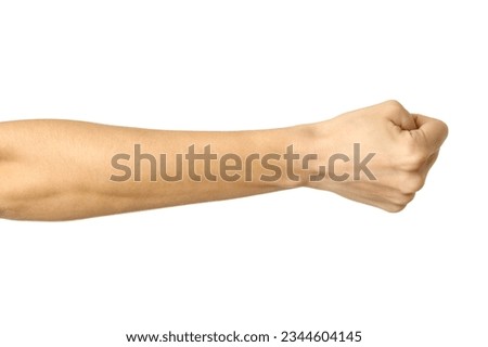 Hand clenched in a fist. Horizontal image. Woman hand with french manicure gesturing isolated on white background. Part of series