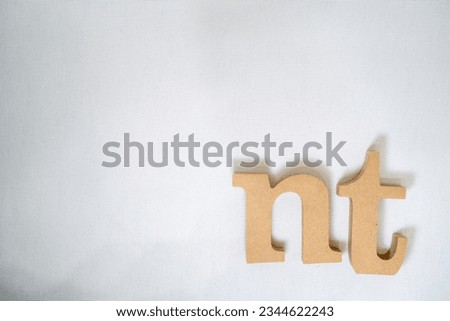 Make the letters "N" and "T" with woodwork