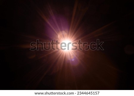 Blurred image Sun flare on the black background