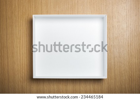 A empty(blank) white box on the desk(table) top view at the studio. Royalty-Free Stock Photo #234465184