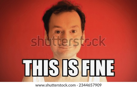 Pop internet culture reaction gif meme: a funny ugly man, happy face, with the caption This is fine.
 Royalty-Free Stock Photo #2344657909