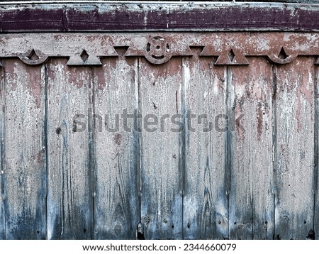 background texture seamless wallpaper old picket fence gray brown red blue close-up vintage geometric wood carving