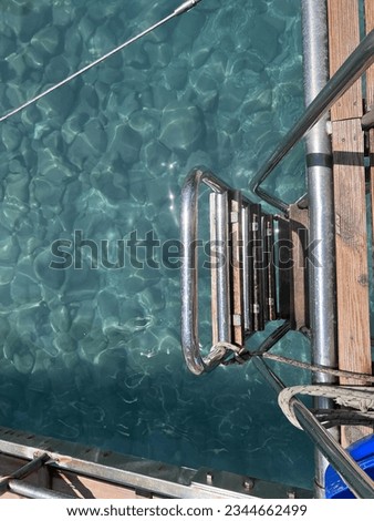 Ship ladder into the turquoise see waters