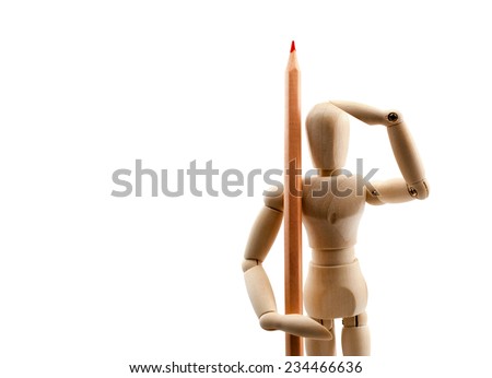 Classic wooden dummy holds red pencil like a soldier, isolated on white.