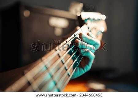 Bassist playing 5 strings bass Royalty-Free Stock Photo #2344668453
