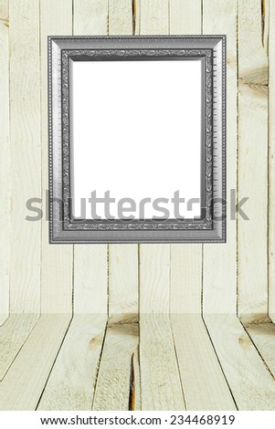 antique picture frame on wooden background.