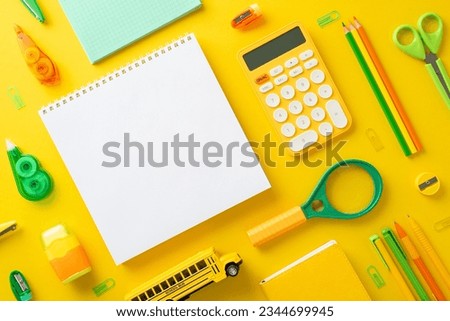 Spark enthusiasm for learning with a above-view shot displaying a student's workspace with notepads and lively school supplies on bright yellow isolated backdrop, perfect for text or advert placement
