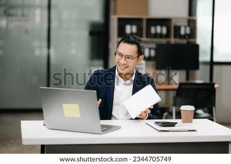 Attractive young lawyer in modern office Business man and lawyers discussing contract papers laptop and tablet with brass scale on  desk in modern office. Law, legal services, advice,

