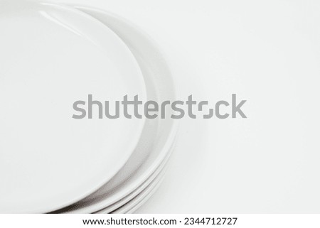 White round plate on white background copy space . High quality photo