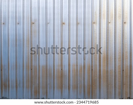 A galvanized wall installed around the industrial factory.