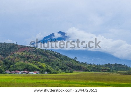 Mount Kerinci (Gunung Kerinci) is the highest mountain in Sumatra, the highest volcano and the highest peak in Indonesia with an altitude of 3805 masl, located in the Kerinci Seblat National Park area Royalty-Free Stock Photo #2344723611