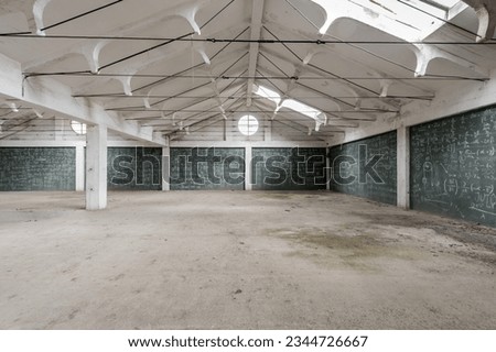 Empty white hall of an industrial building with walls crammed with formulas on a green chalkboard Royalty-Free Stock Photo #2344726667