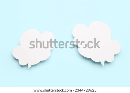 Empty speech bubbles on blue background