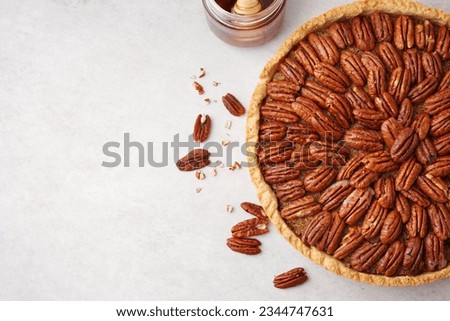 Tasty pecan pie on light background Royalty-Free Stock Photo #2344747631