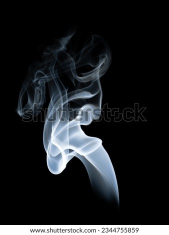 smoke from a match on a black background. Abstract photography.