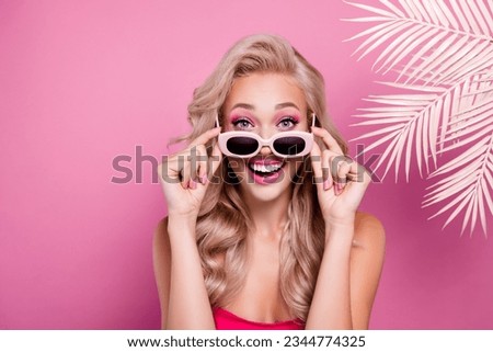 Photo of stunning sweet girl surprised new toy doll promo summer collection presenting on pink background Royalty-Free Stock Photo #2344774325