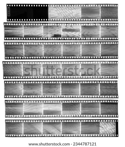 real scan of seven empty 35mm black and white filmstrips with massive scanning light interferences on the material, contact sheet.