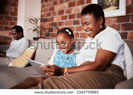 Happy, learning and a mother with a tablet and a child for a cartoon, movies or games on the sofa. Smile, reading and an African family, mom or girl kid with technology for social media in a house