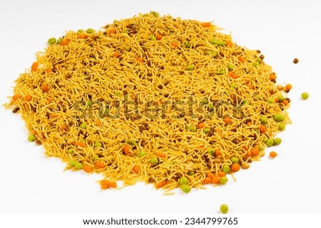 MIXTURE , commonly known as "Chivda" or "Namkeen," is a popular and delicious savory snack in India, a mixture of various crunchy and flavorful ingredients,  Royalty-Free Stock Photo #2344799765