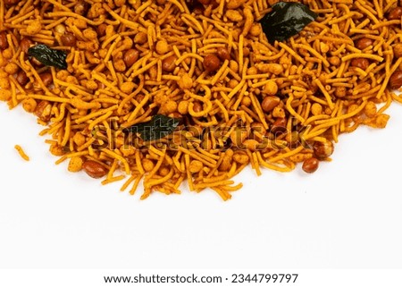 MIXTURE , commonly known as "Chivda" or "Namkeen," is a popular and delicious savory snack in India, a mixture of various crunchy and flavorful ingredients,  Royalty-Free Stock Photo #2344799797