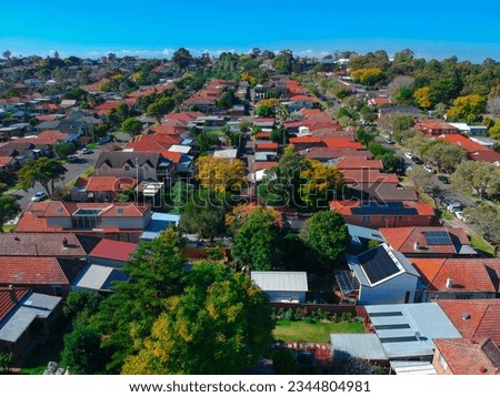 Drone view looking down on sydney residential houses in Sydney suburbia suburban house roof tops and streets  NSW Australia  Royalty-Free Stock Photo #2344804981