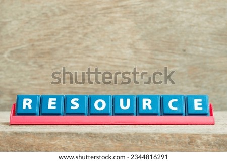 Tile alphabet letter with word resource in red color rack on wood background