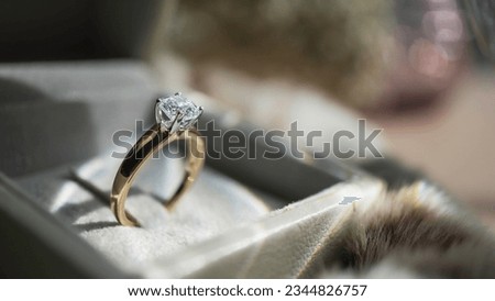 Close up of diamond ring with sunlight and shadow background. Love, valentine, relationship and wedding concept. Soft and selective focus. Royalty-Free Stock Photo #2344826757