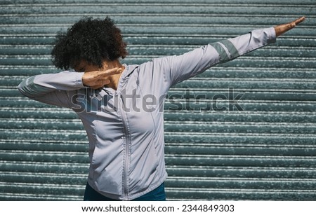 Dabbing, dance and a person on a city wall for hip hop, celebration or fitness. Urban, sports and a female athlete moving for workout, exercise success or training in a town for outdoor cardio Royalty-Free Stock Photo #2344849303