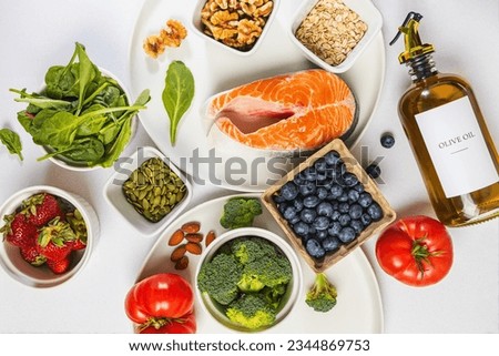 Variety of fresh, whole unprocessed food; healthy nutrition, anti-inflammatory diet products, top view Royalty-Free Stock Photo #2344869753