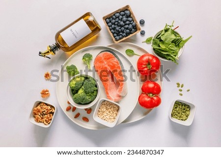Variety of fresh, whole unprocessed food; healthy nutrition, anti-inflammatory diet products, top view Royalty-Free Stock Photo #2344870347