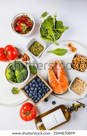 Variety of fresh, whole unprocessed food; healthy nutrition, anti-inflammatory diet products, top view Royalty-Free Stock Photo #2344870899