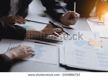 Team of businesswoman working with analysis financial data visualization tech for marketing strategy, Businesswoman accountant or financial report graph at desk in corporate office. 