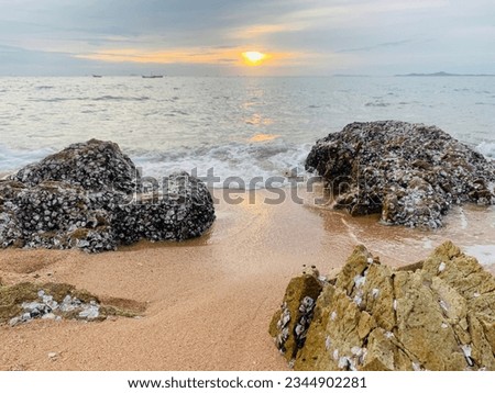Beach and rocks by the sea at sunset. Thai sea. Sea and sky.