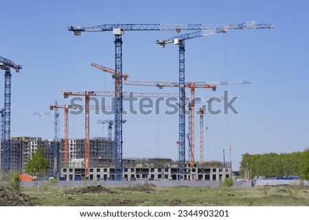 Construction cranes for the construction of a new residential building