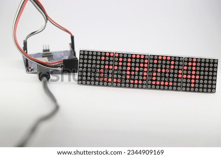 LED matrix display showing the number 2024 and is controlled by a programmable micro controller. Electronic number digital display Royalty-Free Stock Photo #2344909169