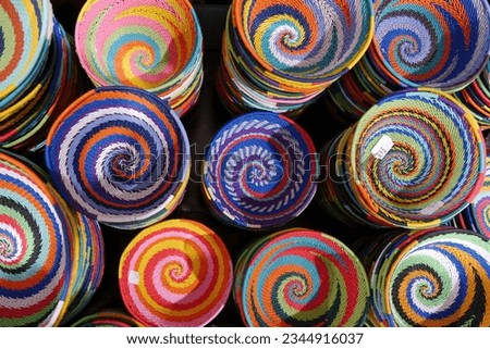 Close up of Small, multi-coloured, handmade baskets on sale, Cape Town, South Africa High quality photo