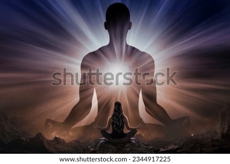 Woman doing yoga in front of giant silhouette of man with universe Royalty-Free Stock Photo #2344917225