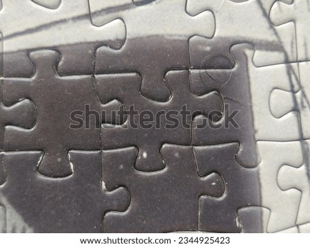 Puzzle pieces in wood background