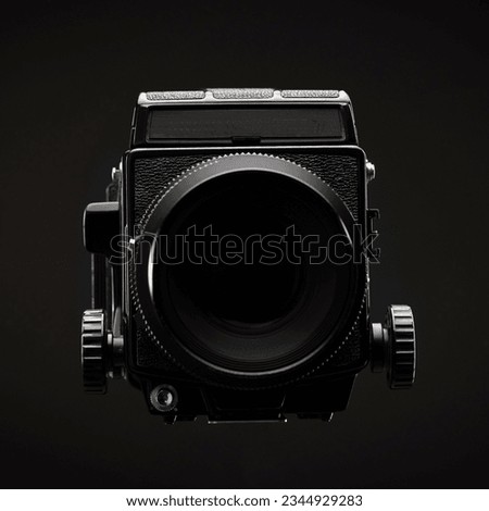 Medium Format Film Camera over Black    