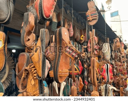 Essaouira mogador city in Morocco. Shopping in the street of Essaouira. Leather shoes products. Royalty-Free Stock Photo #2344932401