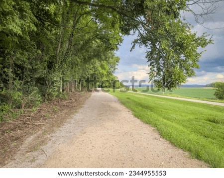 Katy Trail in rural Missouri near Bluffton in summer scenery. The Katy Trail is 237 mile bike trail converted from an old railroad. Royalty-Free Stock Photo #2344955553