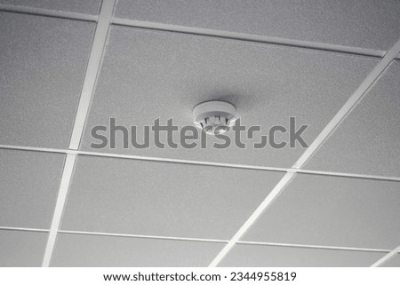 Smoke alarm sensor on a office ceiling