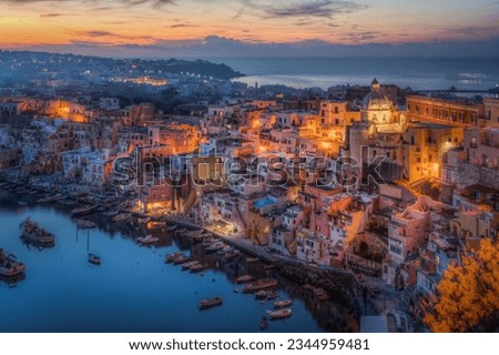 Scenic view of the typical Corricella houses in Procida illuminated at sunset, Campania, Italy Royalty-Free Stock Photo #2344959481