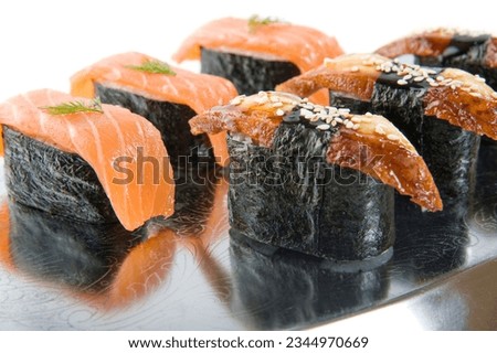 Traditional japanese gunkan with fish fillet. Sushi roll gunkan with eel and salmon 