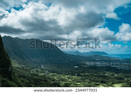 Nuʻuanu Pali Lookout, Oahu, Hawaii. Impressive view of windward Oʻahu from brink of pali (cliffs) at 1200 feet elevation in the Ko’olau Range.  Royalty-Free Stock Photo #2344977031