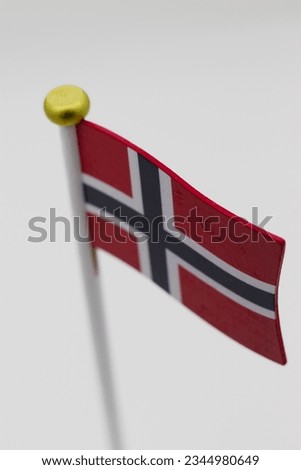Closeup of a wooden Norwegian flag decorative table stand. 